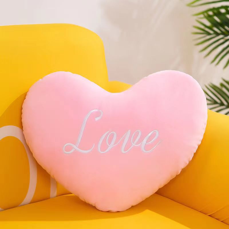 Heart-shaped throw pillow